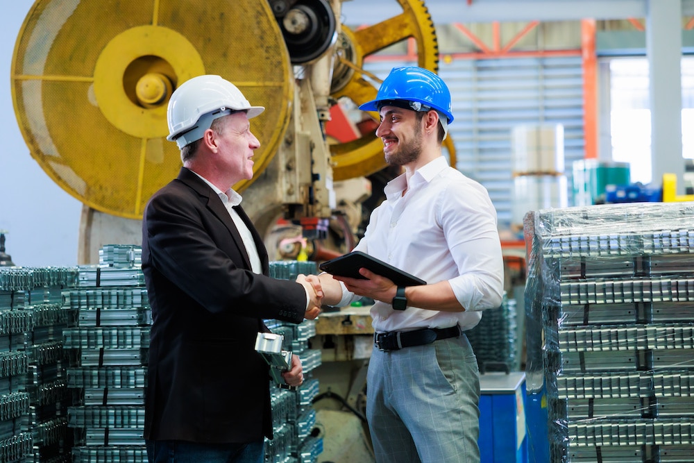 Manufacturer and buyer shaking hands over a flexible service agreement
